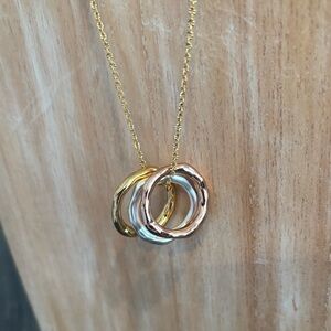 Silver, yellow gold and rose gold ring necklace. Never worn. Great condition!